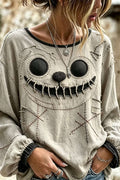 Noelle | Halloween-Inspired Beige Stitched Ghost Face Print Round Neck Long Sleeve Blouse